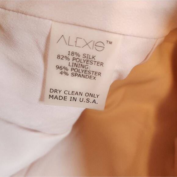 ALEXIS MED PLEATED PINHOLE BLUSH PEPLUM DRESS - Picture 9 of 9